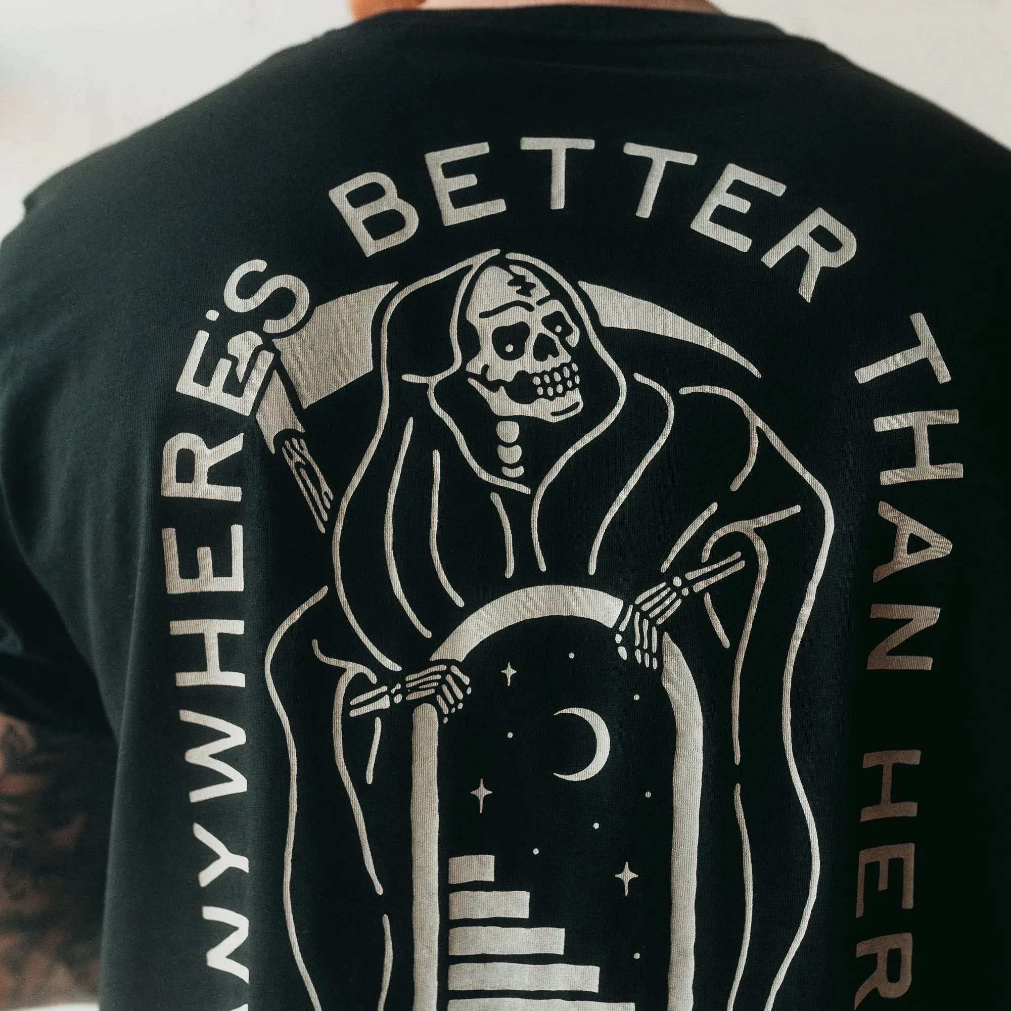 ANYWHERE'S BETTER THAN HERE - BLACK UNISEX T-SHIRT